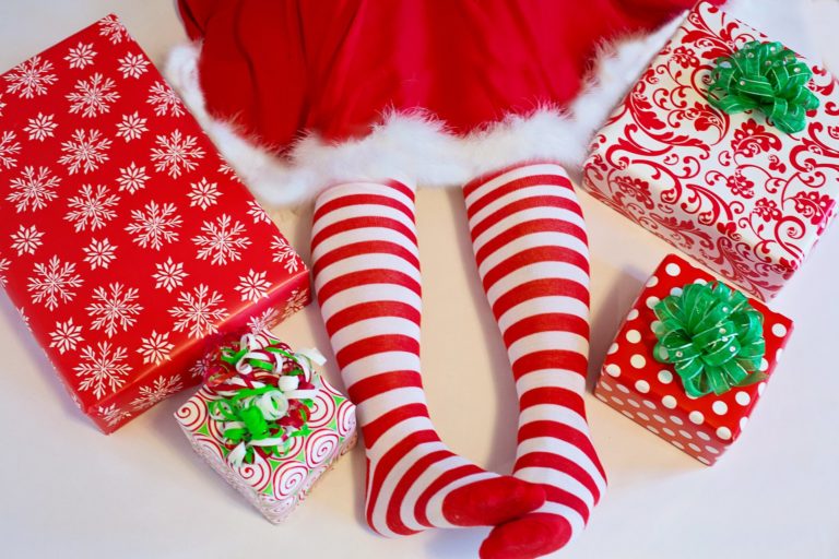 red and white striped socks surrounded by Christmas presents